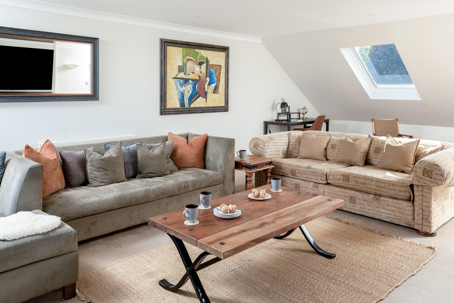 The sitting room is spacious and filled with light.