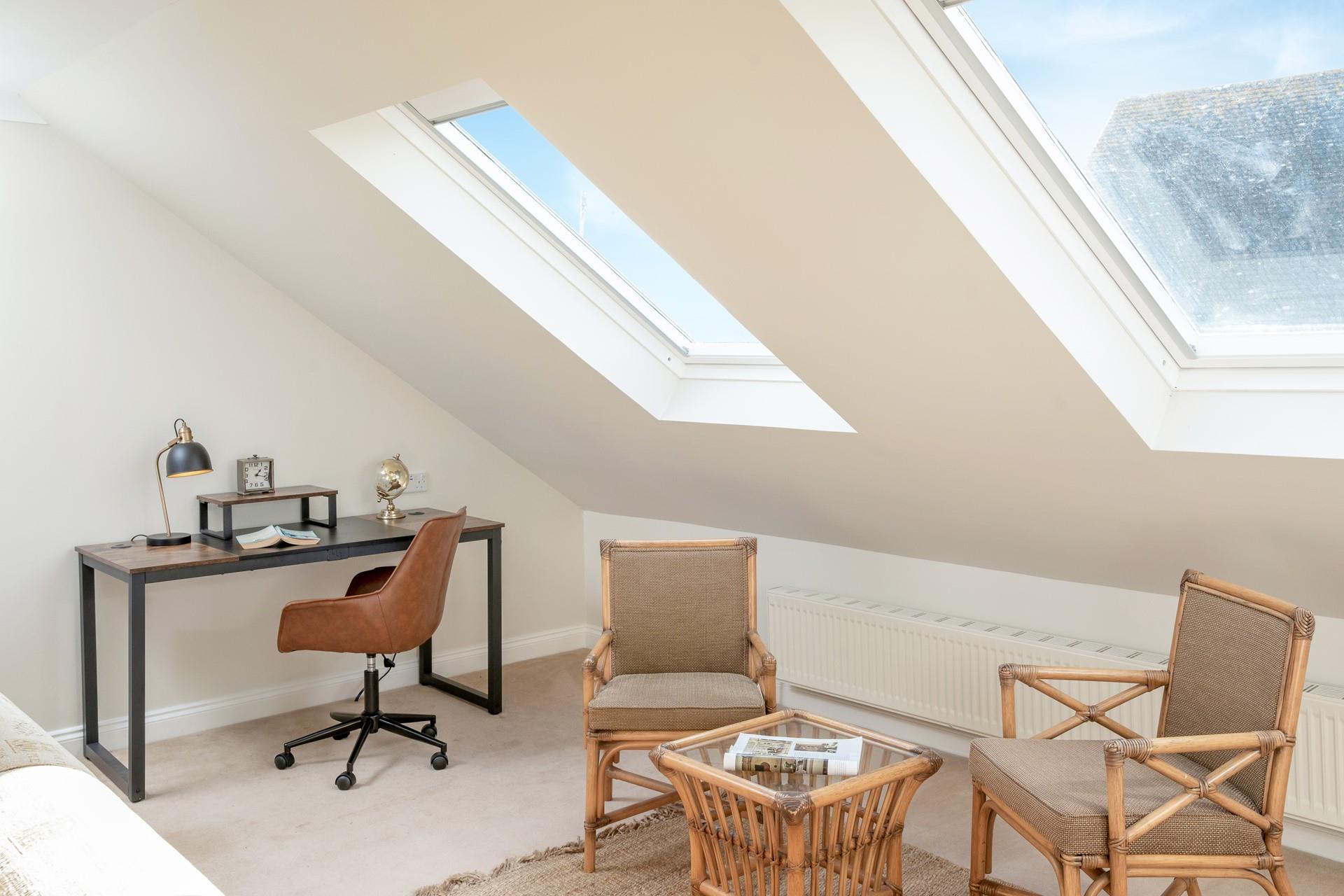 Get stuck into a good book or check some emails at the desk area.