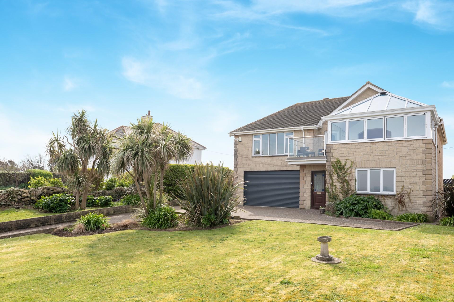 The large front garden offers the perfect space for kids to play.