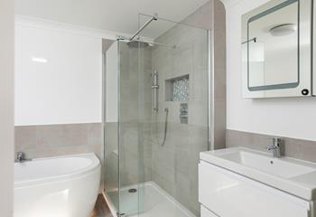 Wash the day away in the sleek and modern en suite.