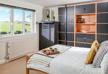 The upstairs bedroom has tranquil countryside views.