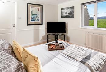 Unwind after a day's adventure in the cosy bedroom.