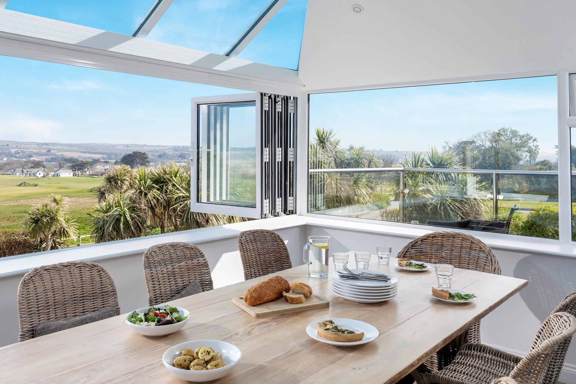 Tuck into a delicious feast, enjoying the sun and sea views.