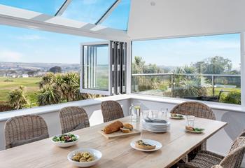 Tuck into a delicious feast, enjoying the sun and sea views.