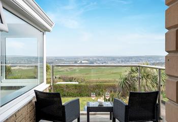 Relax on the balcony admiring the view.