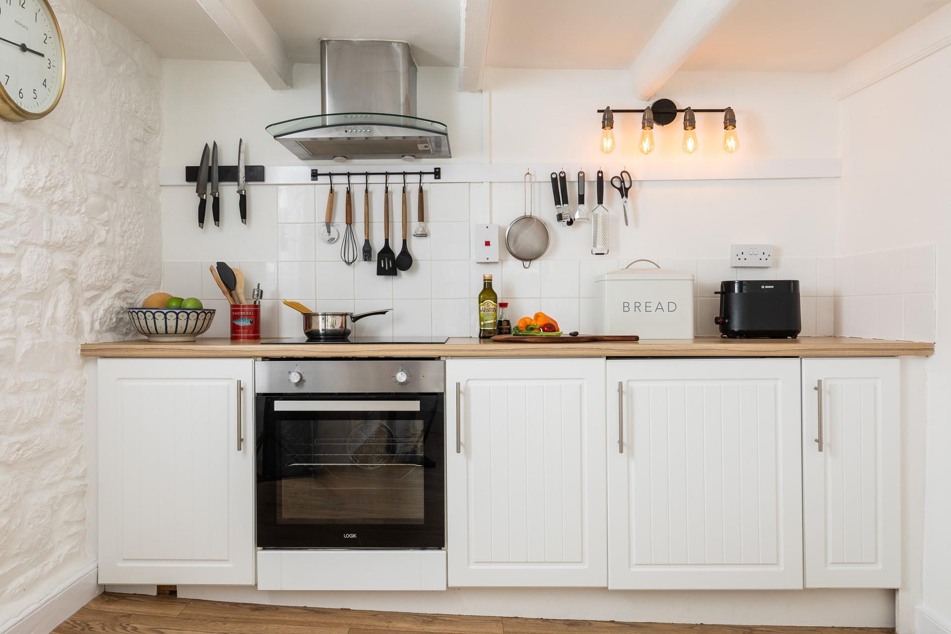 The kitchen is fully equipped for cooking tasty meals.