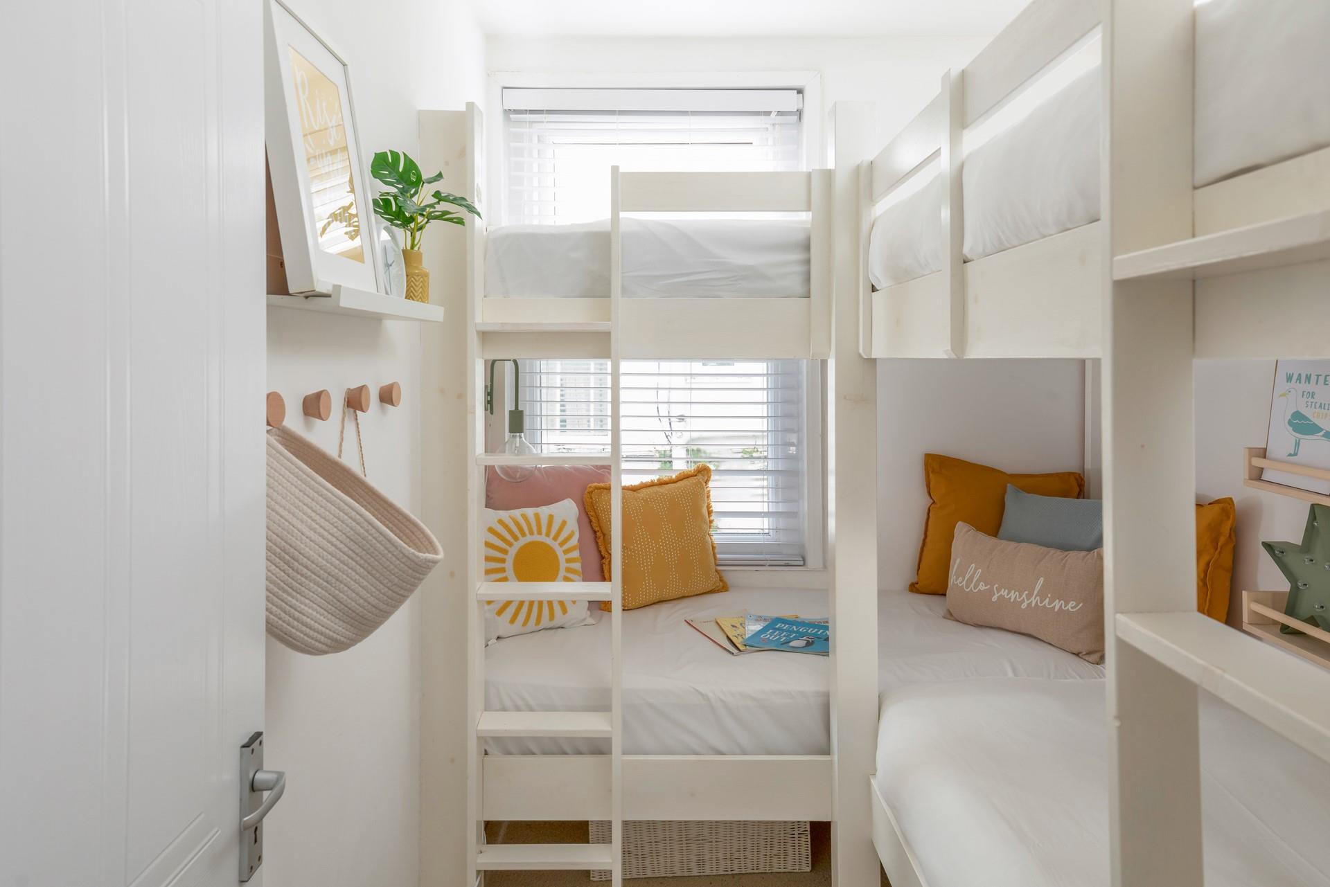 Little ones will love the bunk beds with added reading nooks!