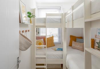Little ones will love the bunk beds with added reading nooks!