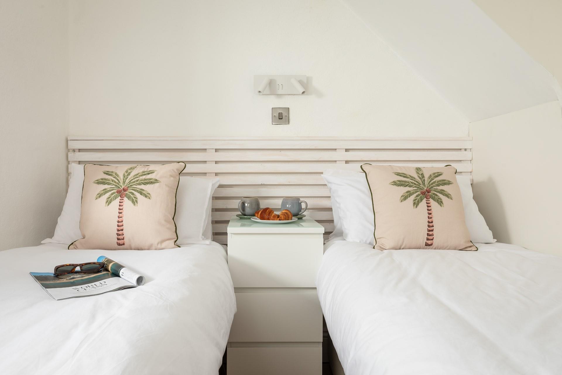 Bedroom 1 has twin beds for a relaxing night's slumber.