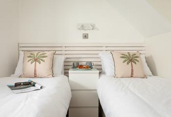Bedroom 1 has twin beds for a relaxing night's slumber.