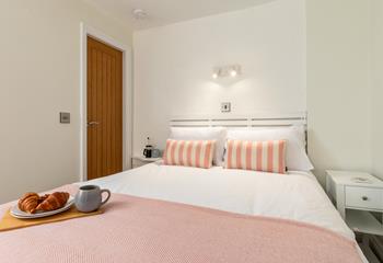 Cosy up in the king size bed in bedroom 2.