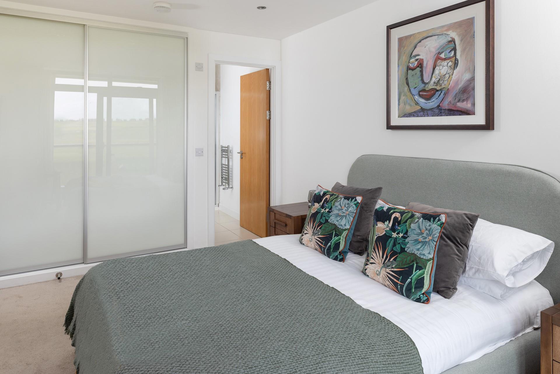 Bedroom 1 boasts built in storage and an en suite.