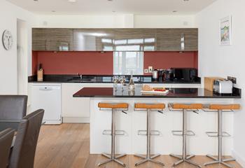 The sleek kitchen has all you need.