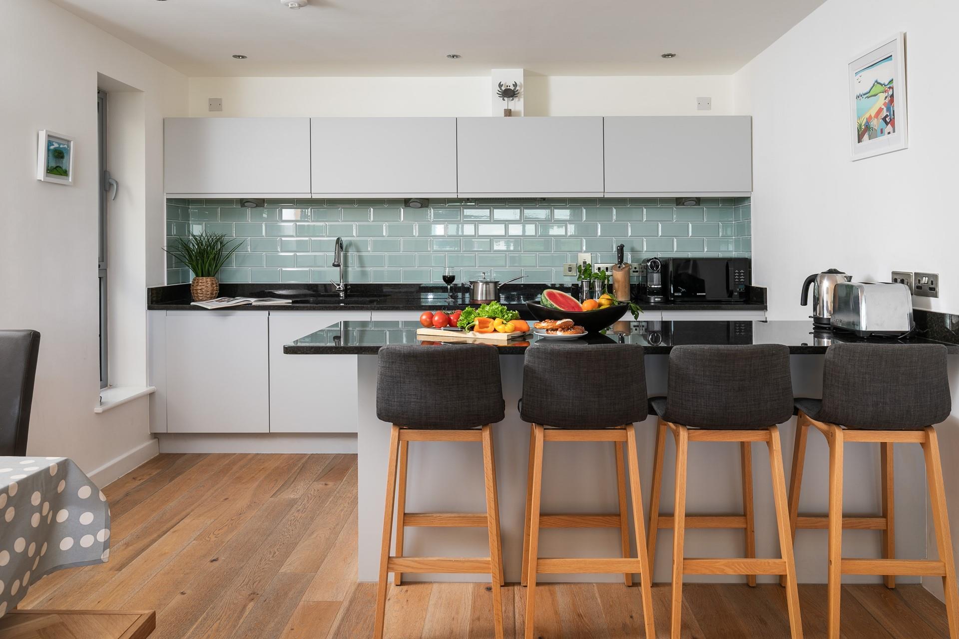 The sleek kitchen has all you need.