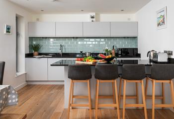 The sleek kitchen has all you need.