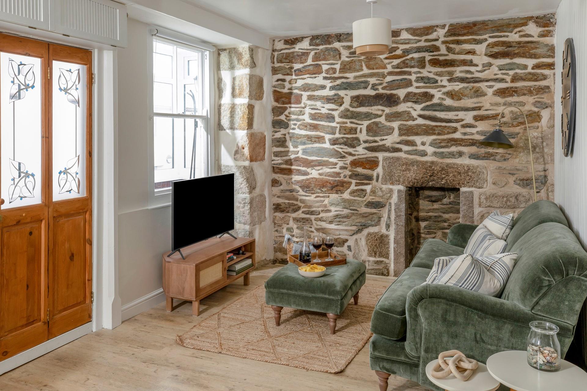 Traditional, charming features such as the exposed stone wall add to the character.