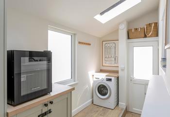 There is a handy washing machine and utility area.
