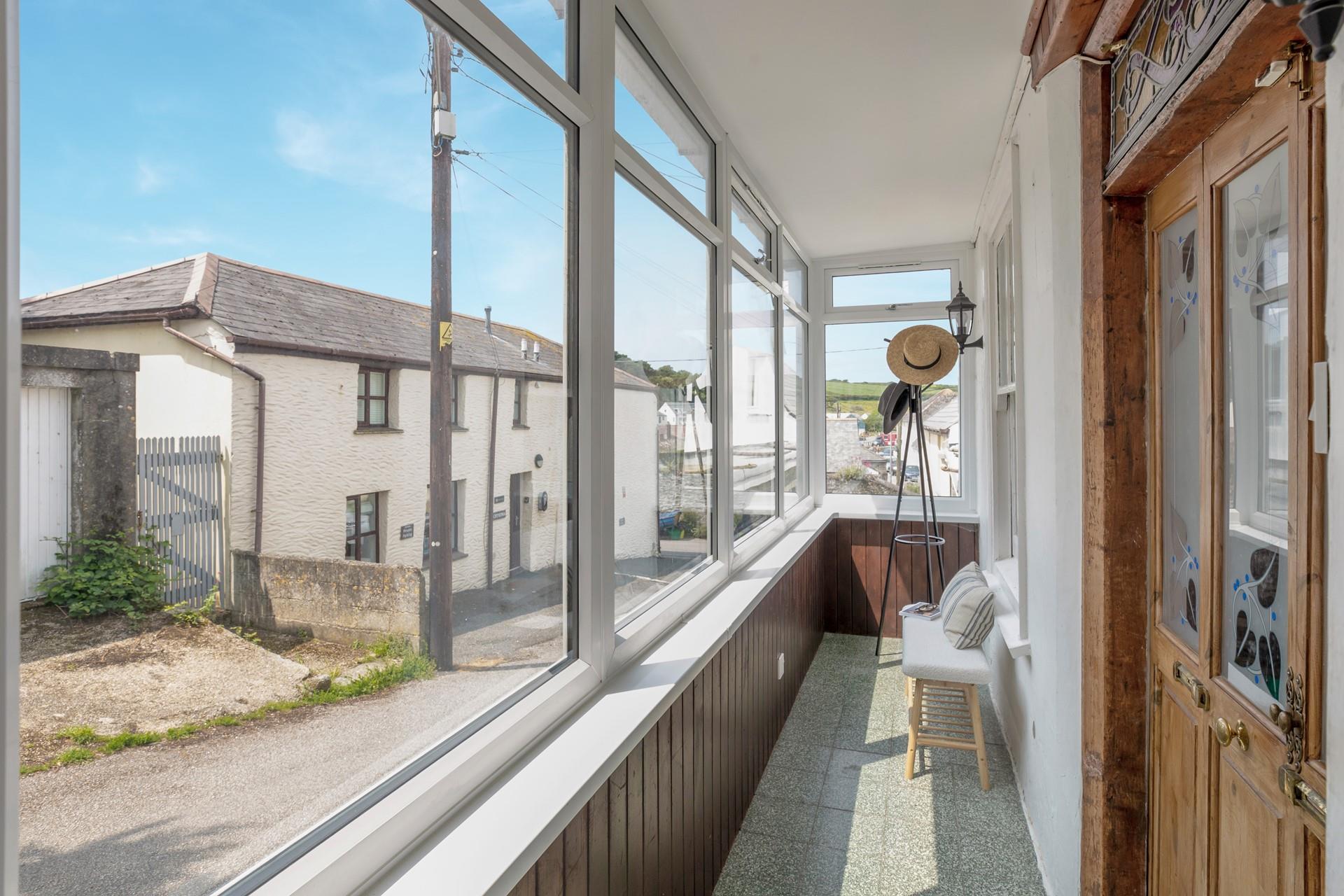 The porch area is ideal for keeping buckets and spades.