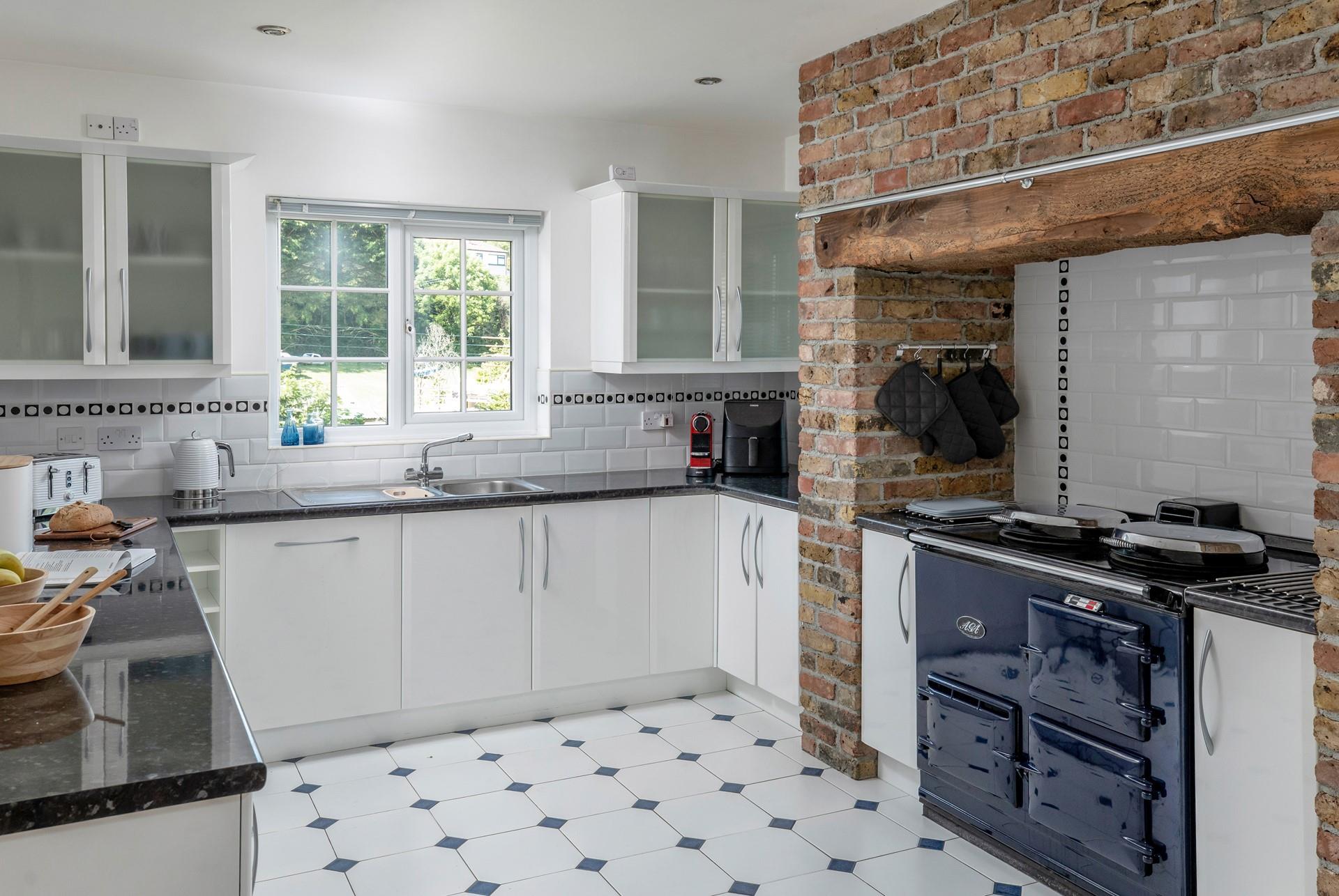 The kitchen has all the modern amenities you need and a beautiful decorative range.