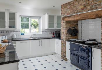 The kitchen has all the modern amenities you need and a beautiful decorative range.