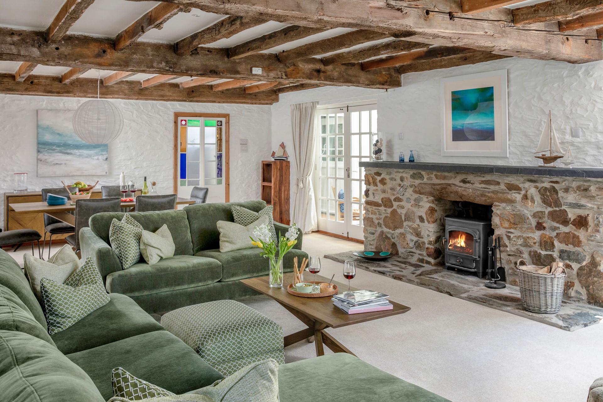 Quirky and characterful, the sitting room has exposed beams and a woodburner.