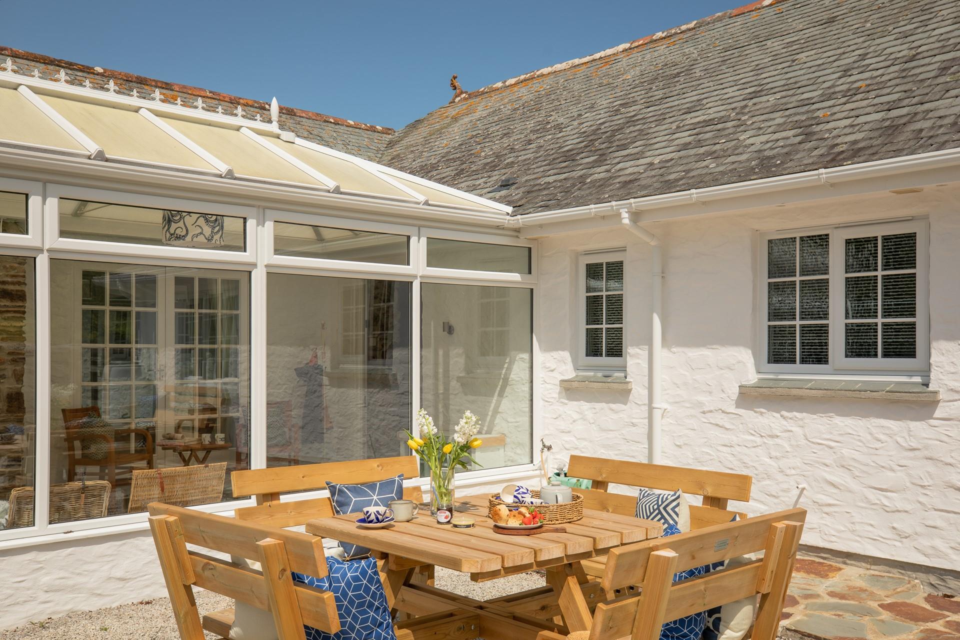 Devour a cream tea in the sunshine.