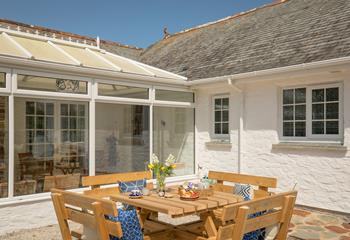 Devour a cream tea in the sunshine.