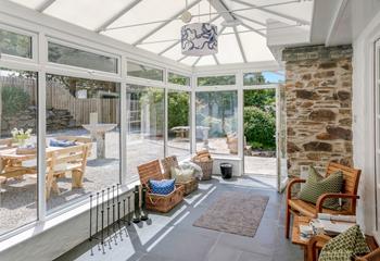 The conservatory is an additional space to relax.