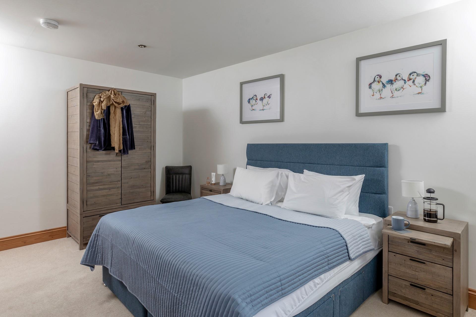 The bedrooms are decorated with coastal blues.