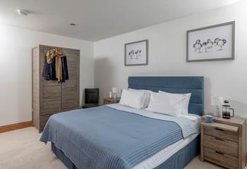 The bedrooms are decorated with coastal blues.