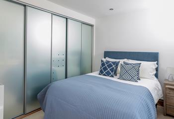 Bedroom 2 has a king-size bed and a built-in wardrobe.