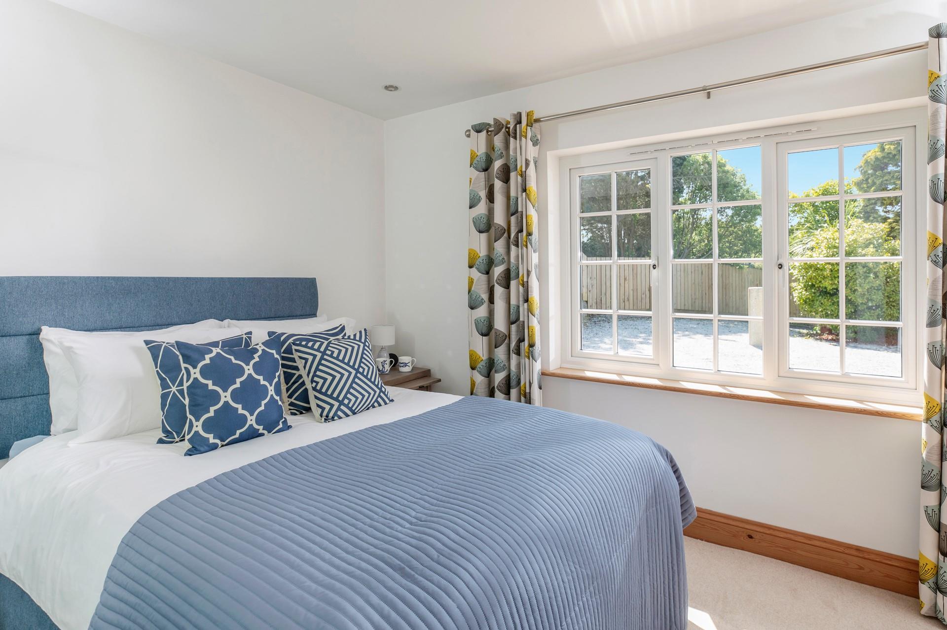 Coastal blues await in bedroom 2.