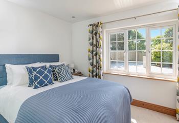 Coastal blues await in bedroom 2.