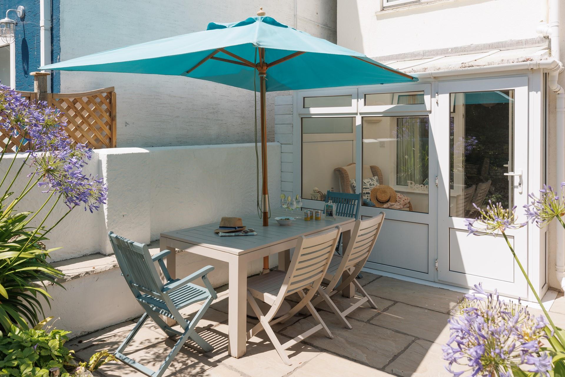 Sip a gin and tonic in the garden as the sun goes down.