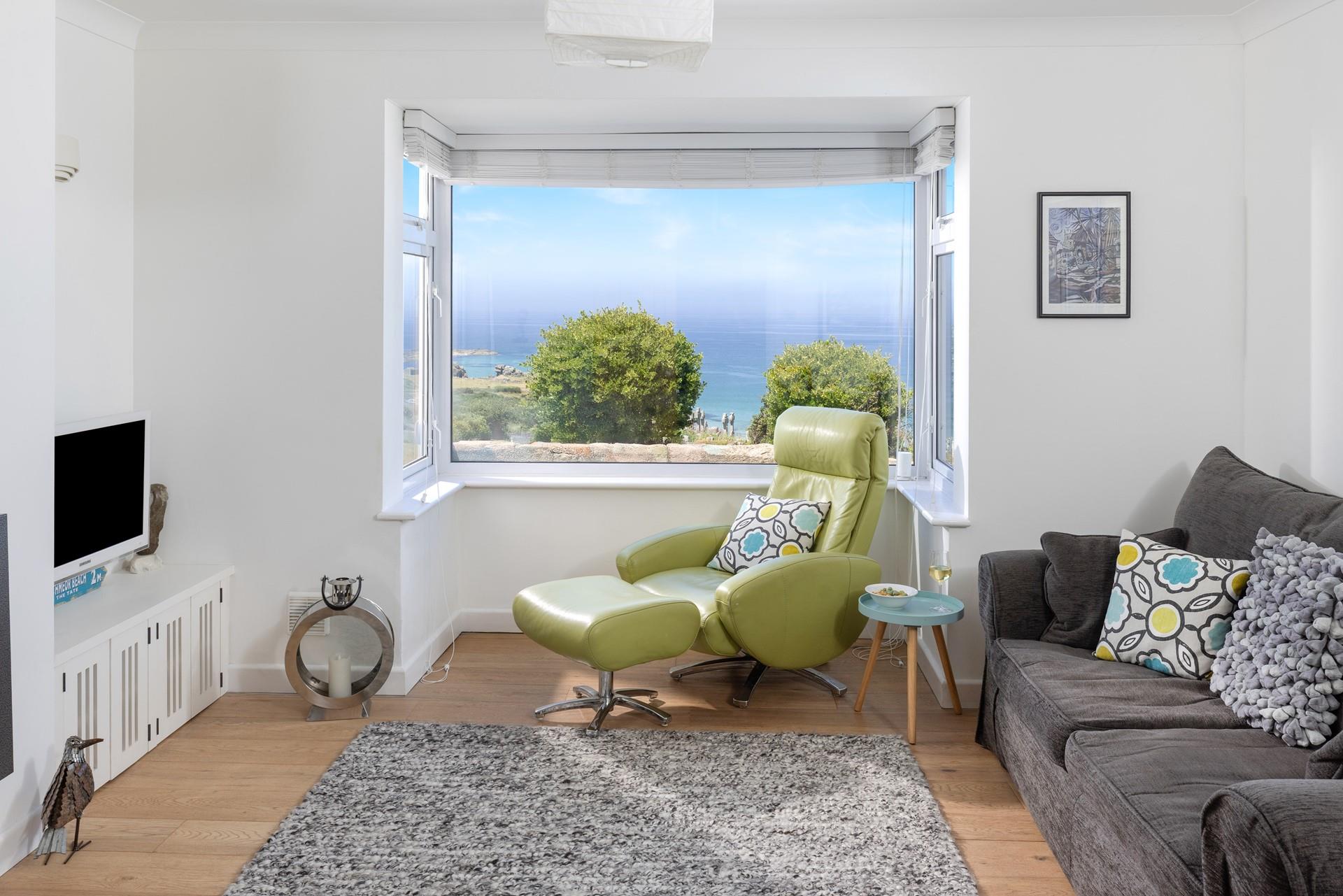 The sitting room is cosy and light.