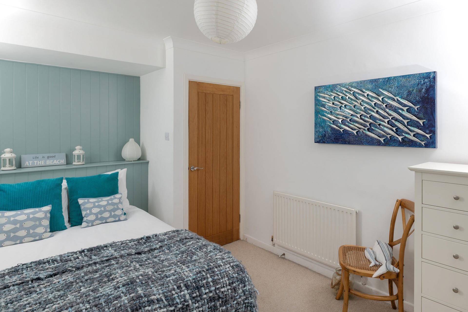 The bedrooms are decorated with ocean blues.