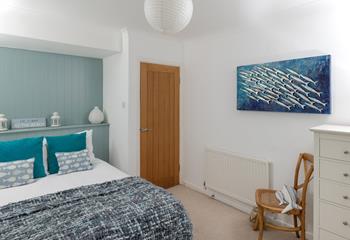 The bedrooms are decorated with ocean blues.