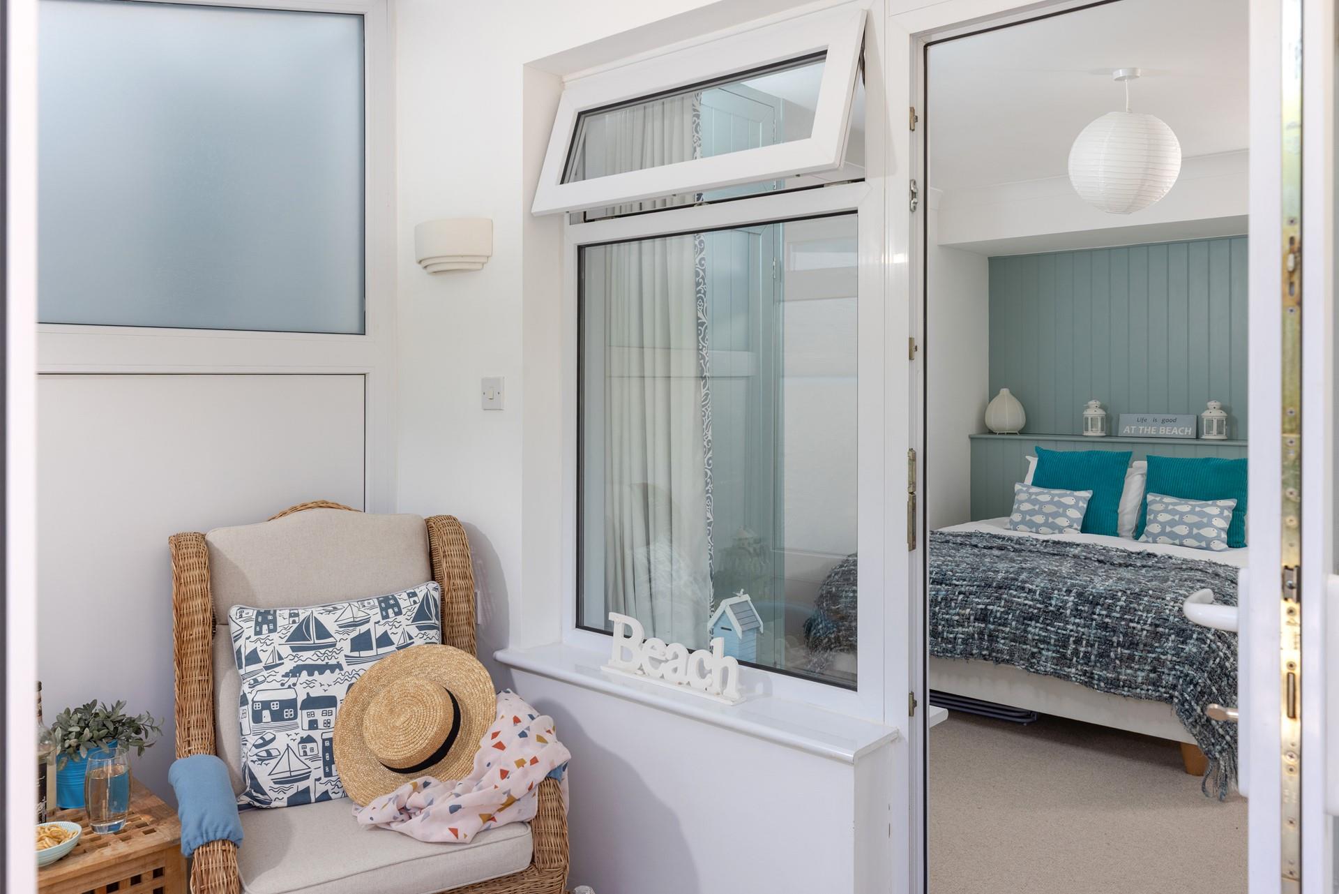 After a day on the beach, return to enjoy the garden and conservatory area.