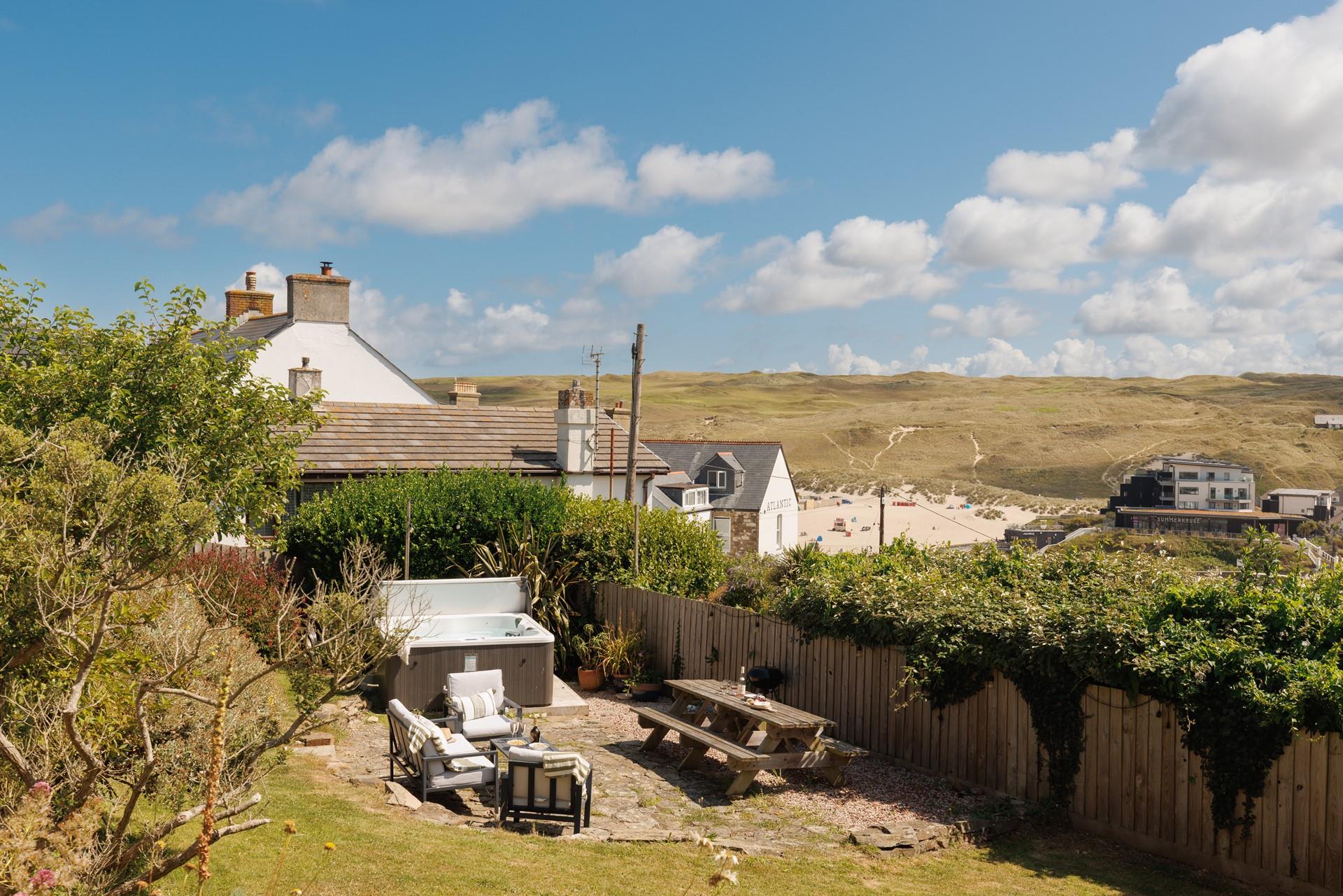 Take a dip in the bubbly hot tub in the evening sun.