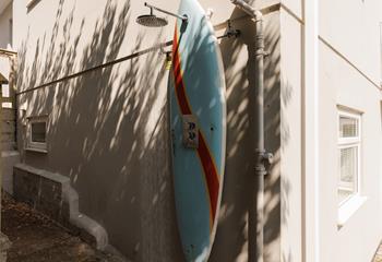 Wash off sandy wetsuits under the handy outside shower.