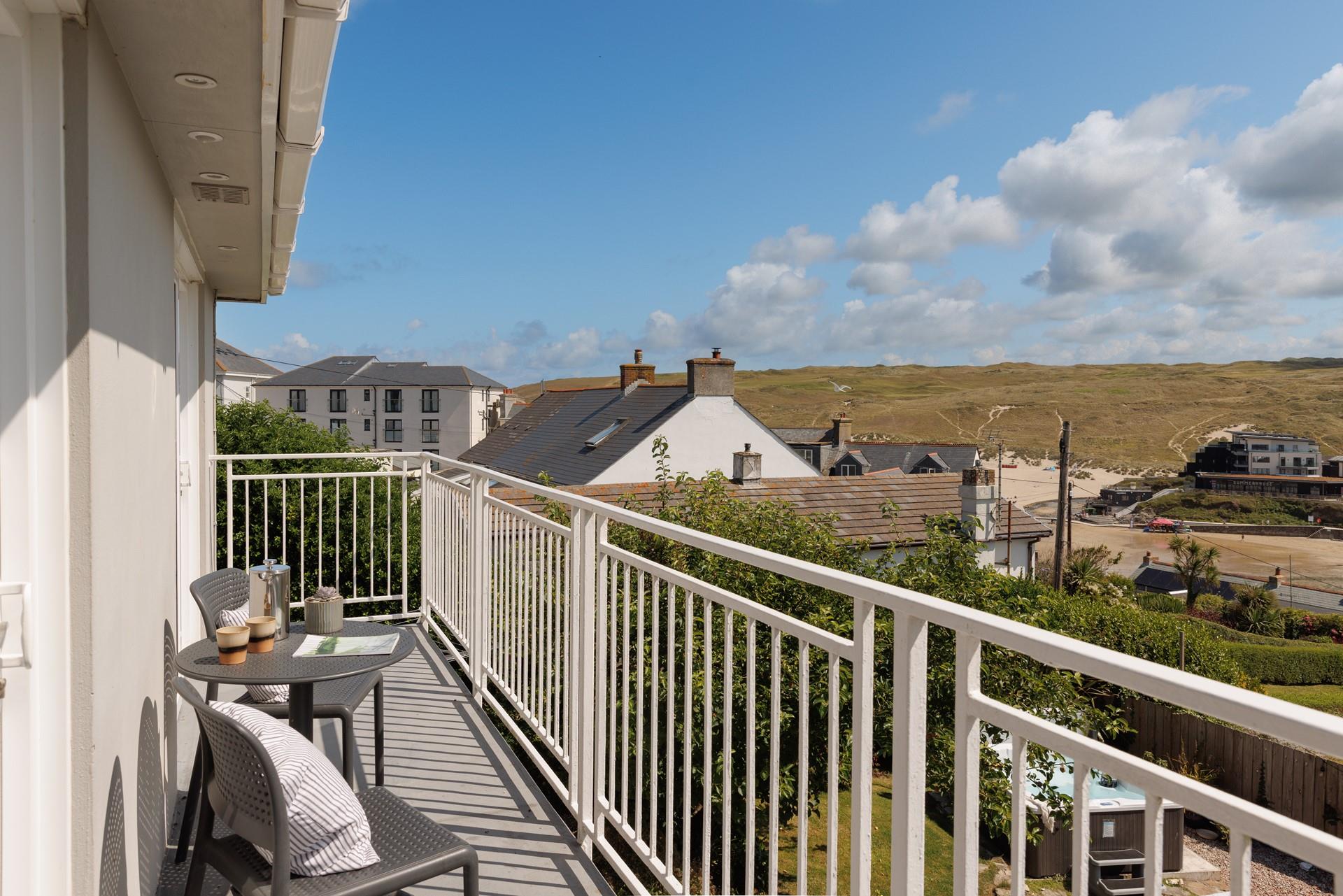 The balcony offers lovely views of the garden stretching across to Perranporth beach.