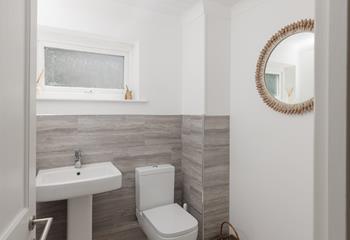 The cloakroom has a WC and a basin.