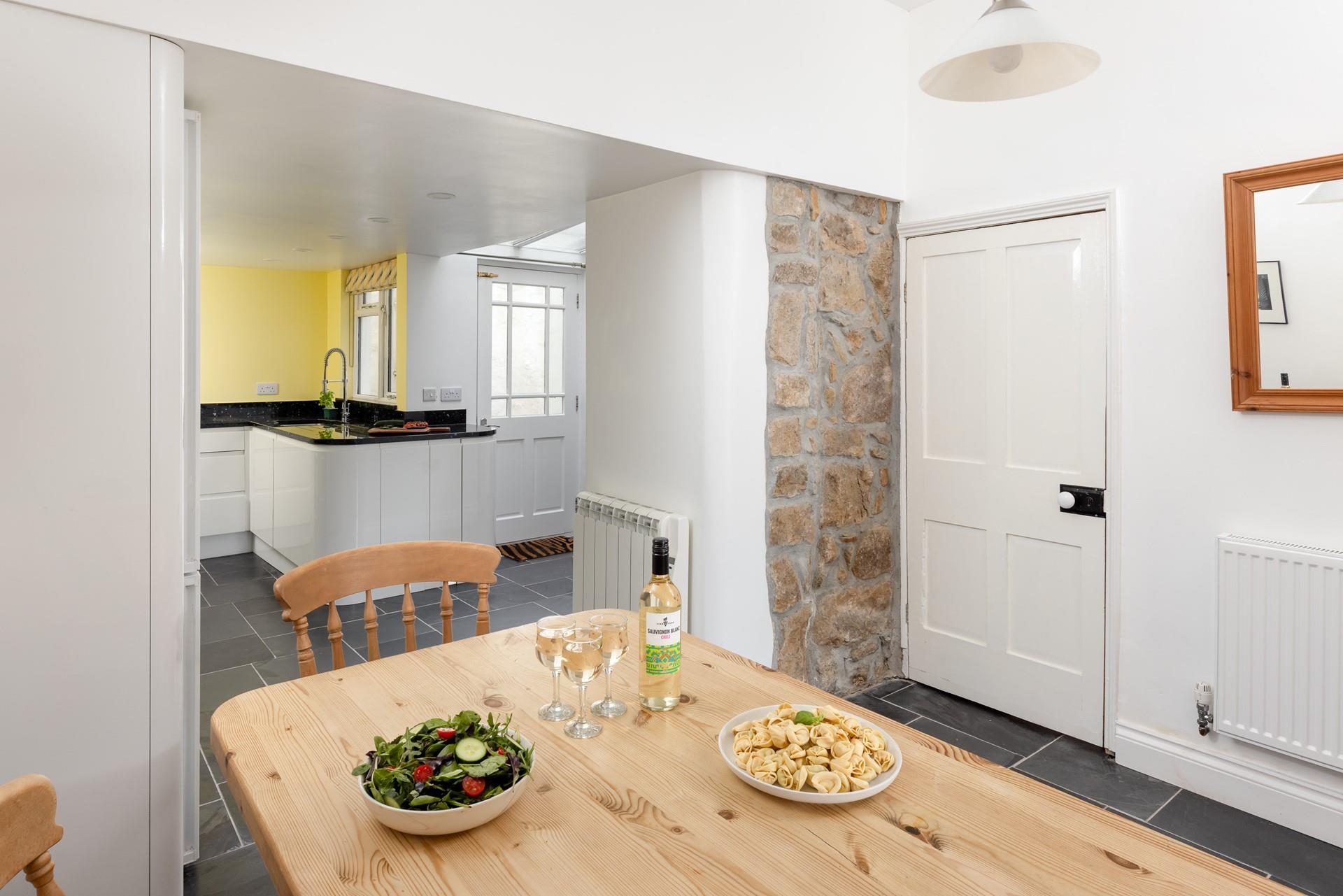 The dining area flows beautifully between the sitting room and kitchen.