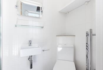 The second en suite offers another warming towel rail.
