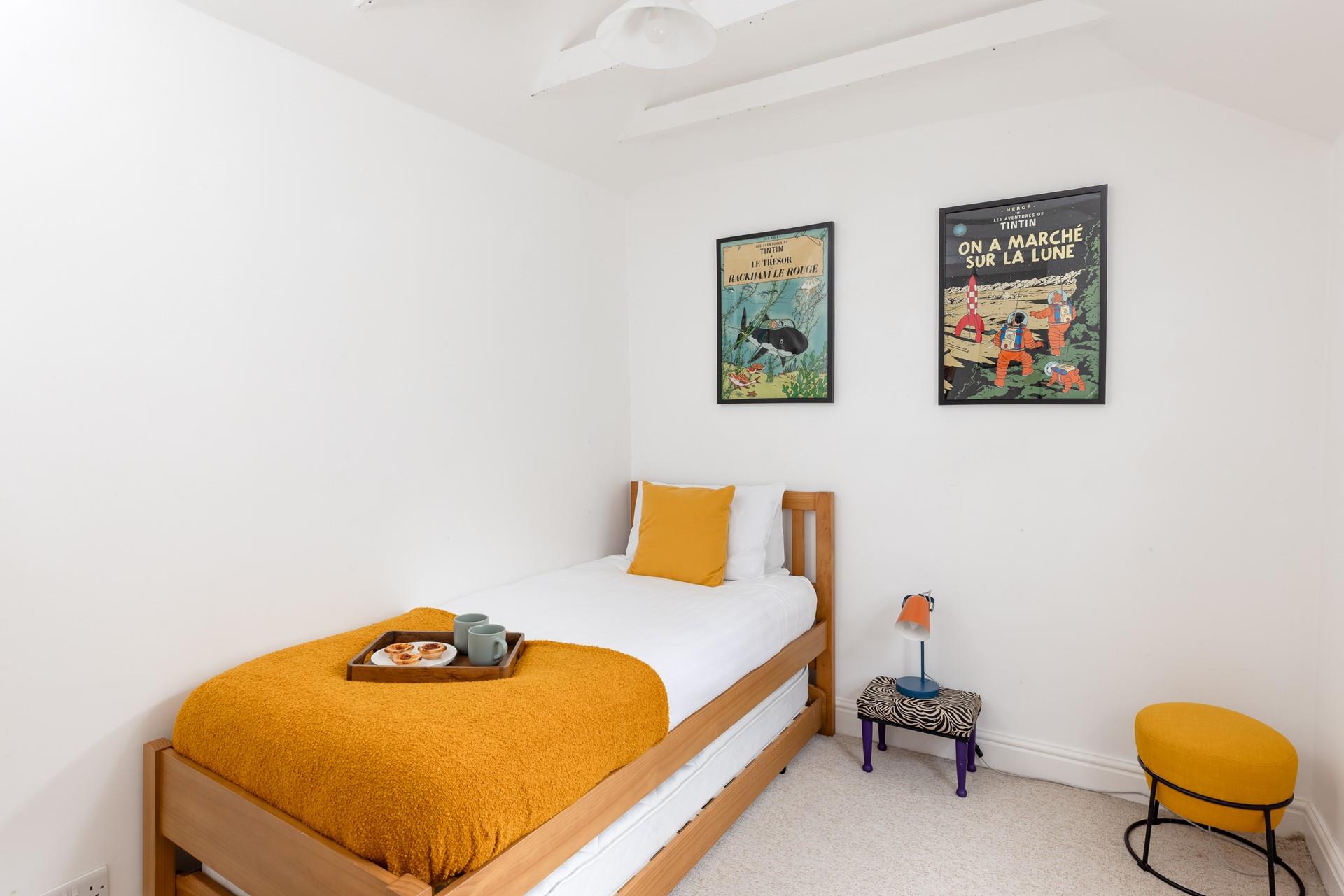 Perfect for kids or young adults, the single bedroom has a handy trundle bed.