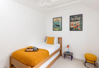 Perfect for kids or young adults, the single bedroom has a handy trundle bed.