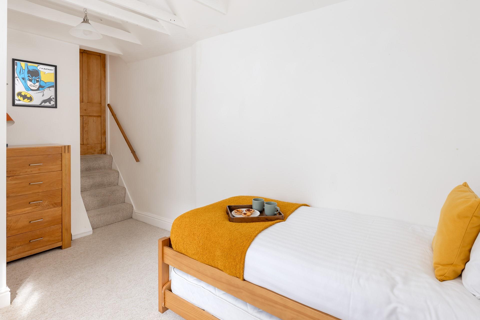 Steps down take you from bedroom 2 into the adjoining single.