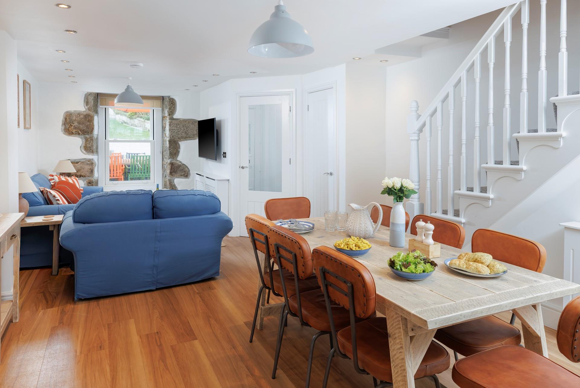 The dining table seats 8 comfortably, ideal for the family to enjoy meals together.