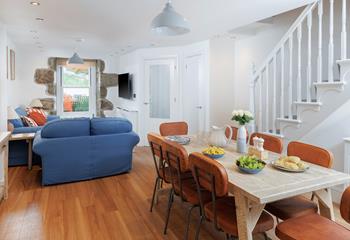 The dining table seats 8 comfortably, ideal for the family to enjoy meals together.