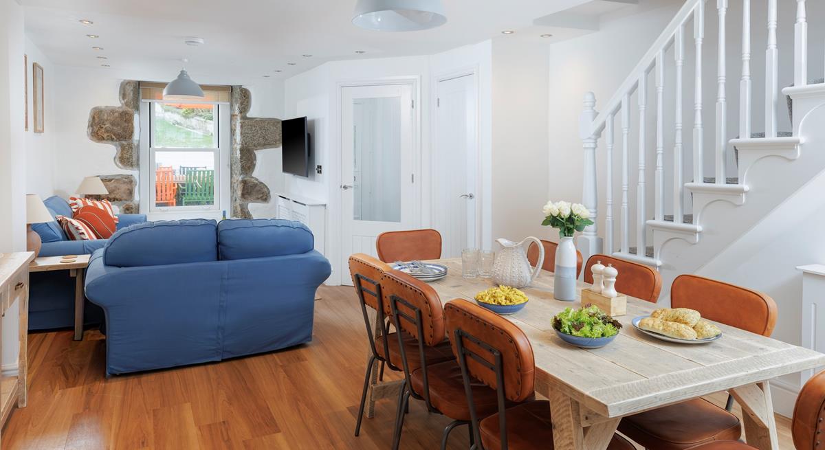 The dining table seats 8 comfortably, ideal for the family to enjoy meals together.